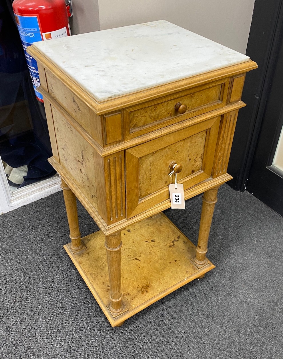 An early 20th century French marble topped bird's eye maple bedside table, width 40cm, depth 35cm, height 77cm